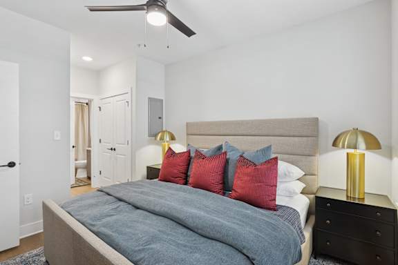 A bedroom with a bed, nightstands at Union Eleven Apartments, Atlanta, Georgia