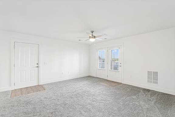 A room with a ceiling fan and carpeted floor at The Parker North Augusta, North Augusta, SC, 29841