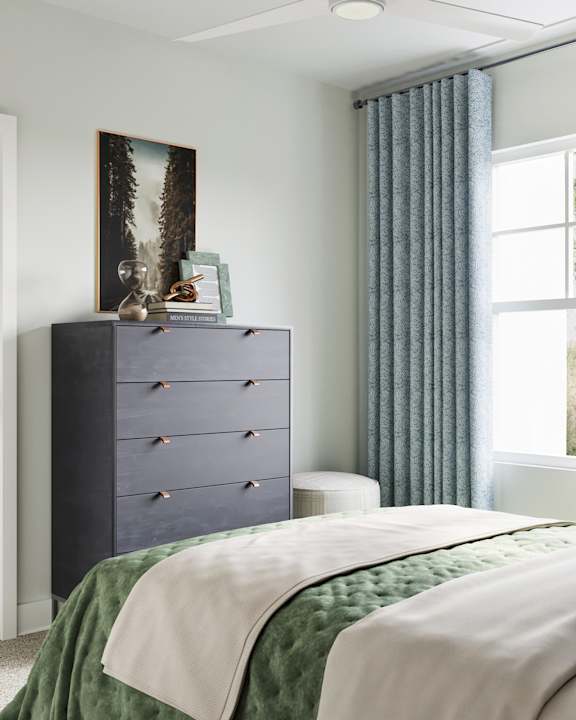 A bedroom with a large bed and a dresser with a picture on top at The SoHo Luxury Apartments, North Carolina