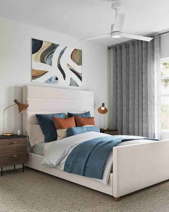 A bedroom with a large bed, a ceiling fan at The SoHo Luxury Apartments, Raleigh, North Carolina
