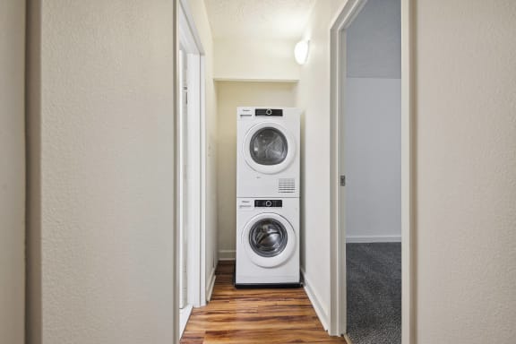 a small laundry room with a washing machine and a dryer