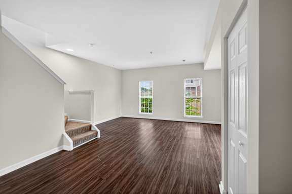 A room with wooden floors and white walls.