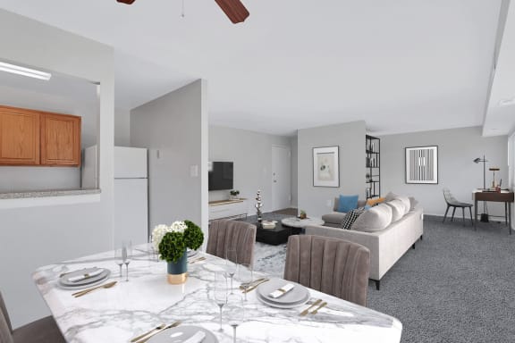 a living room and dining room with a table and chairs