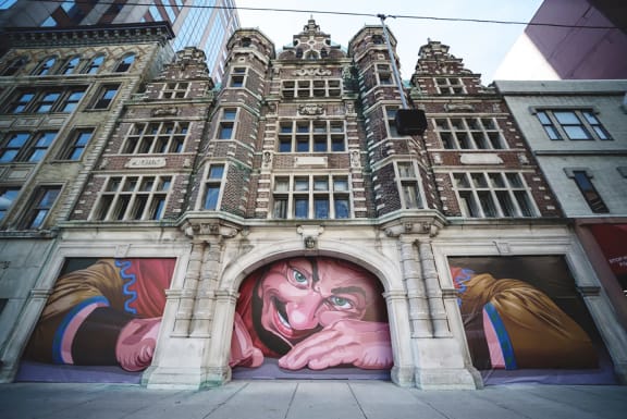 a large mural on the side of a building at Art Lofts at Dayton Arcade apartments in Dayton, OH