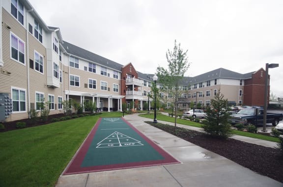 Shuffleboard in a courtyard at Cambridge Heights Senior Living Apartments in St. Louis, MO