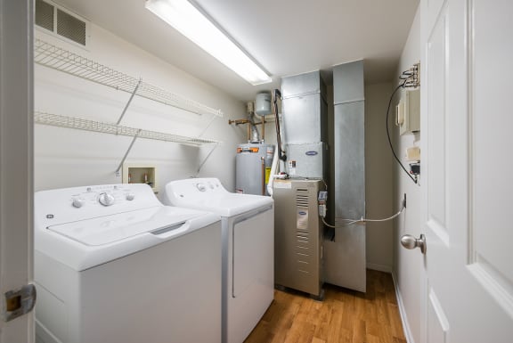 a laundry room with two washes and a dryer at Duneland Village apartments and townhomes in Gary, IN