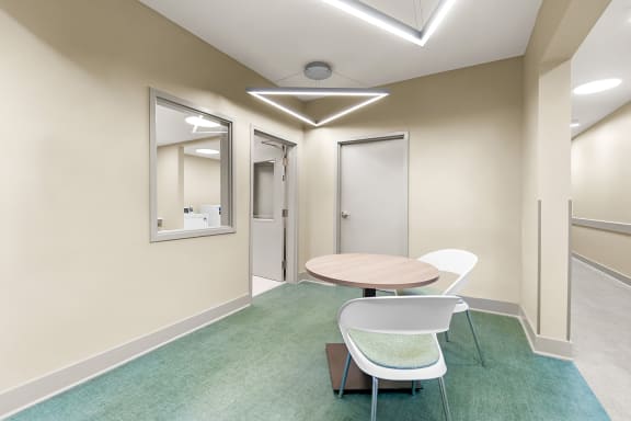 a small sitting area outside a laundry room at South City Senior Apartments in Memphis, TN