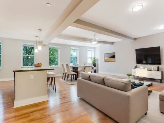 a living room and dining room with a couch and a table