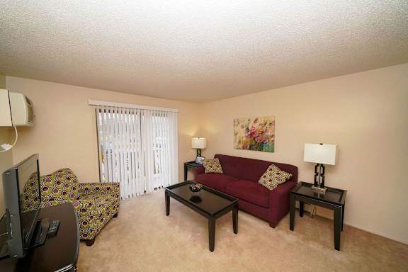 a living room with a couch and a tv