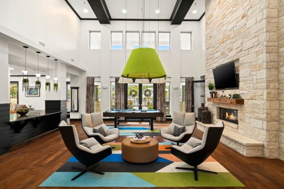 a living room filled with furniture and a fireplace