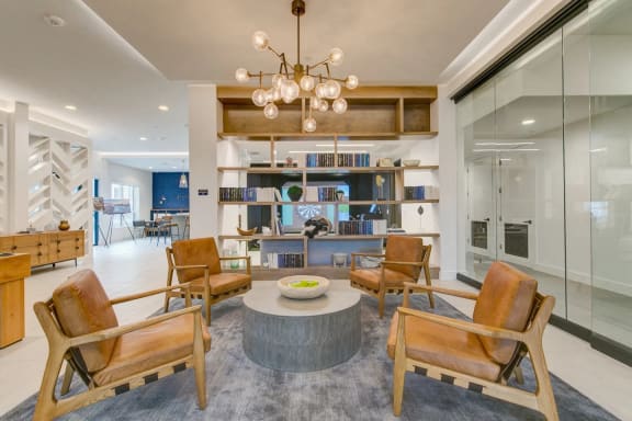 a living room filled with furniture and a chandelier