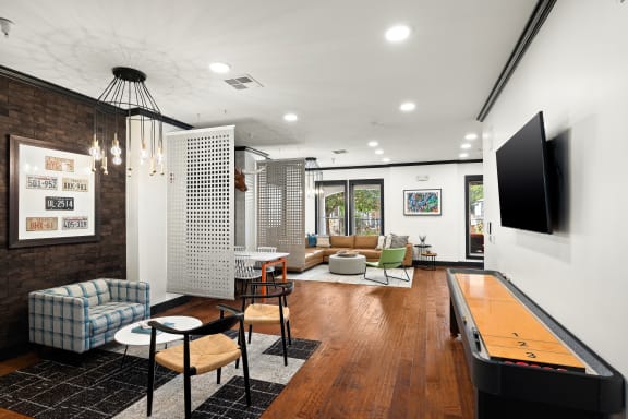 a living room with a television and a table