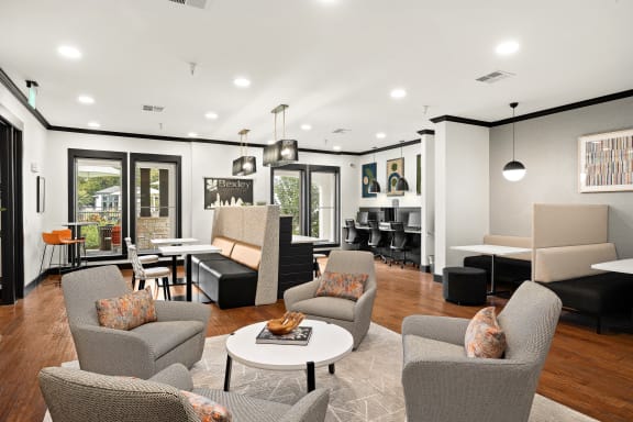 a living room with couches and chairs and a table