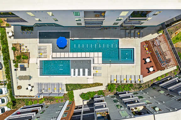 A large swimming pool with a blue circle in the middle.