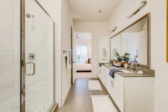 a small bathroom with a shower and a sink