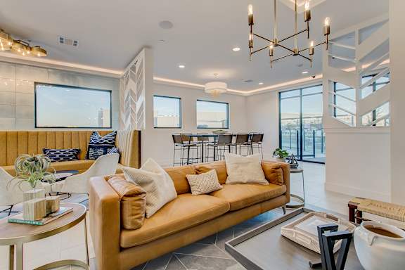 A modern living room with a large couch and a coffee table.