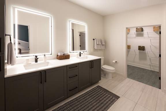 A bathroom with two sinks and a toilet.