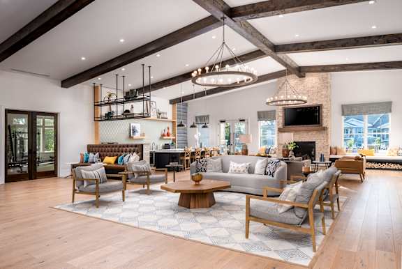 A modern living room with wooden floors and furniture.