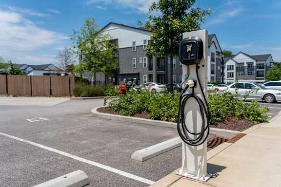 A charging station for electric vehicles is located in a parking lot.