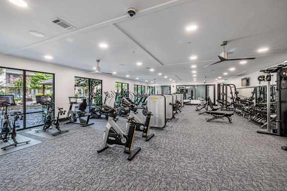 A spacious gym with a variety of exercise equipment.