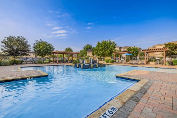 a swimming pool with a blue and purple sky