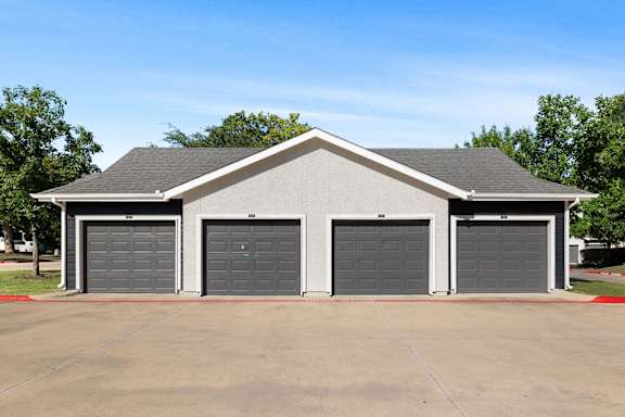 A two-car garage with a grey roof and grey doors.