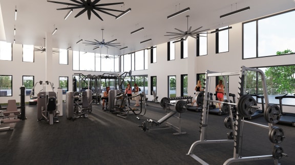 a gym with a lot of exercise equipment and windows