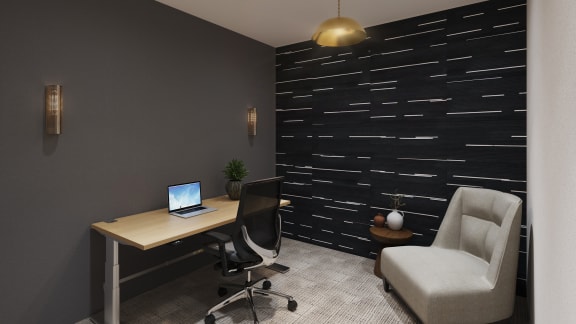 a desk with a laptop and a chair in a room