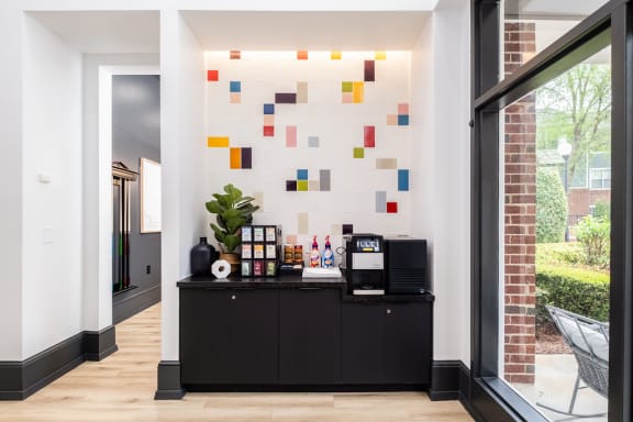 a living room with a black bar and a window