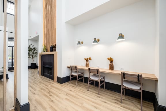 a dining room with wooden tables and chairs and a fireplace