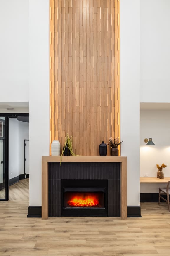 a fireplace with a woodeneworkework above it in a living room
