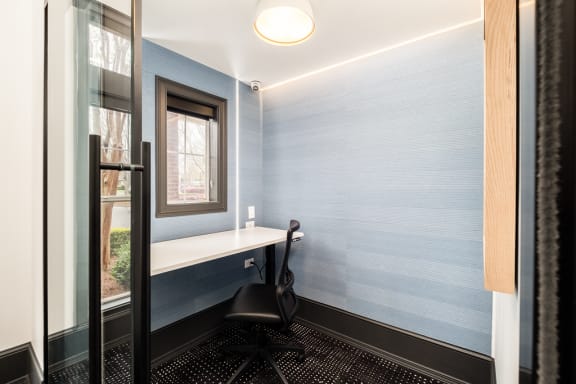 a small office space with a desk and a chair