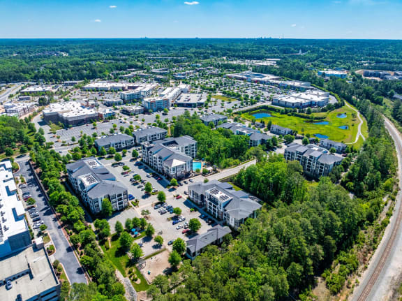 an aerial view of a city with buildings and trees