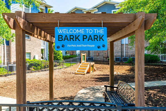 A sign that says "Welcome to the Bark Park" is displayed.