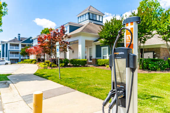 A charging station is in front of a building.