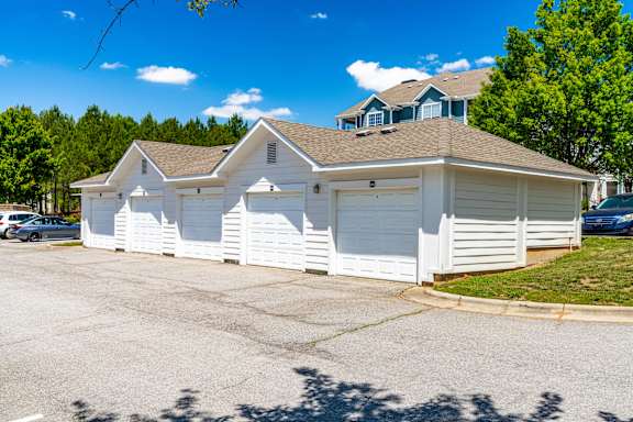 A two-story house with a white garage door.