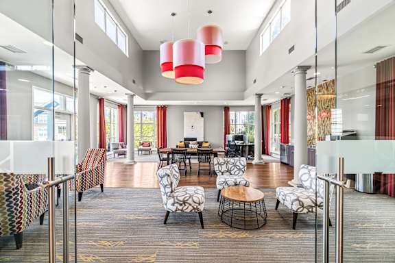 A large, open living room with a dining area in the background.