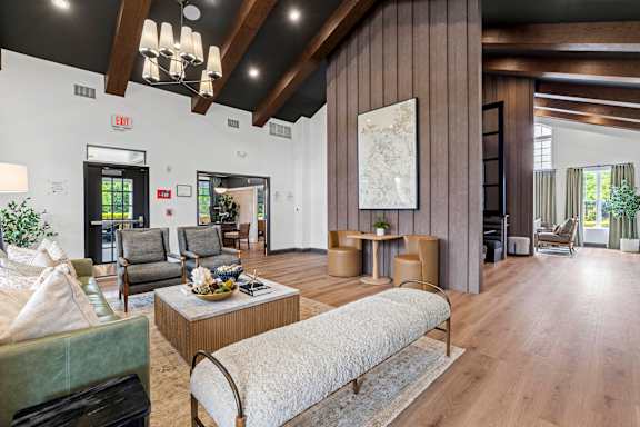 A living room with a large couch and a coffee table.