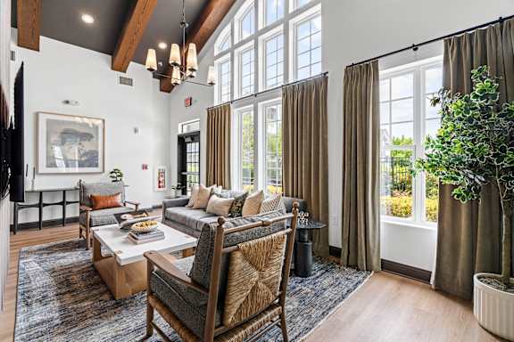 A living room with a couch, chair, and table.