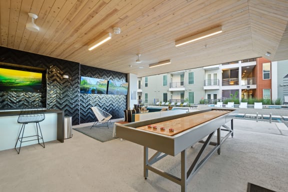 Covered Poolside Sports Lounge with TVs and Shuffleboard