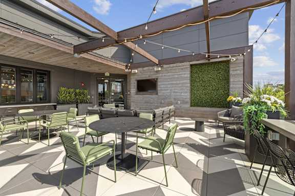 A patio with tables and chairs is shown.