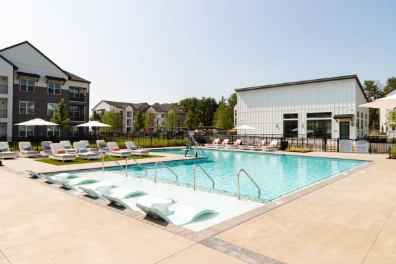 our apartments have a large swimming pool with lounge chairs