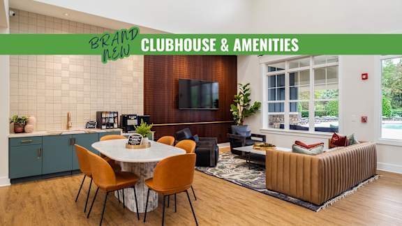 A modern clubhouse and amenities area with a dining table and chairs.