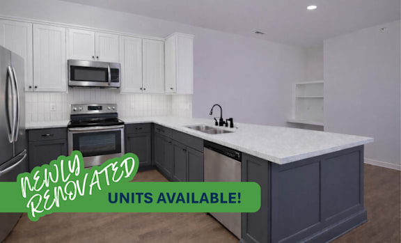 A newly renovated kitchen with a large island in the center.