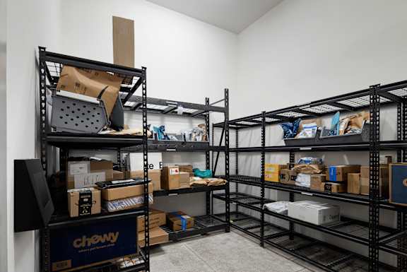 A storage room with shelves filled with boxes and items.
