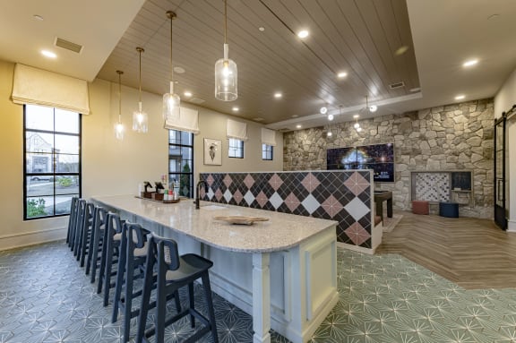 a view of a restaurant with geometric patterns on the ceiling