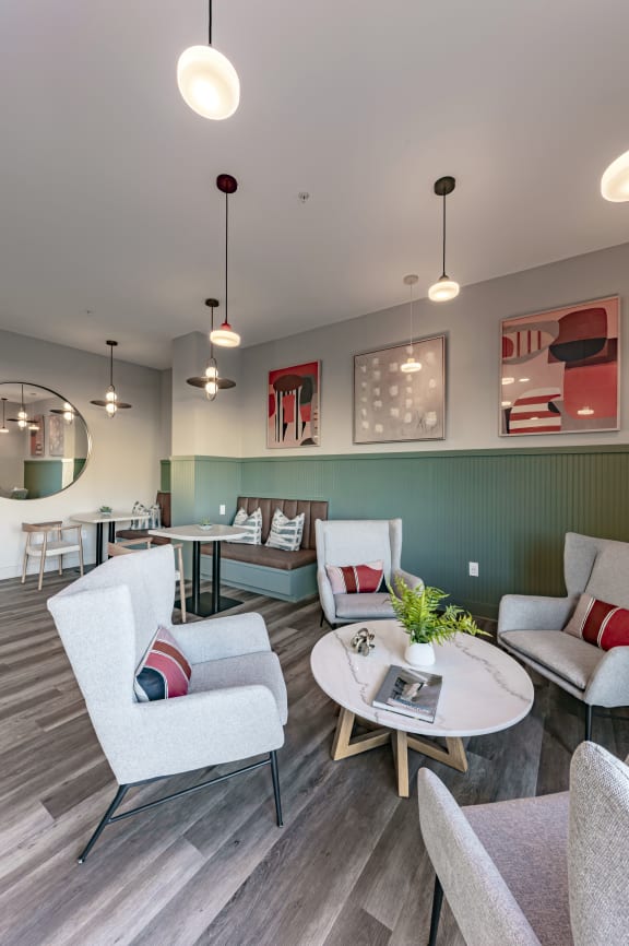 a living room with couches and chairs and a table
