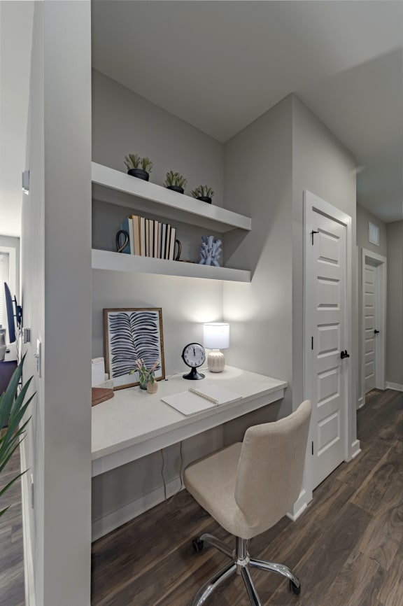 a home office with a desk and a chair