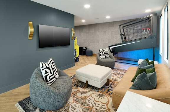 A modern living room with a grey ottoman and a white bench.