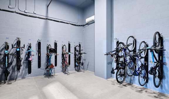 A bike rack with many bikes on it.